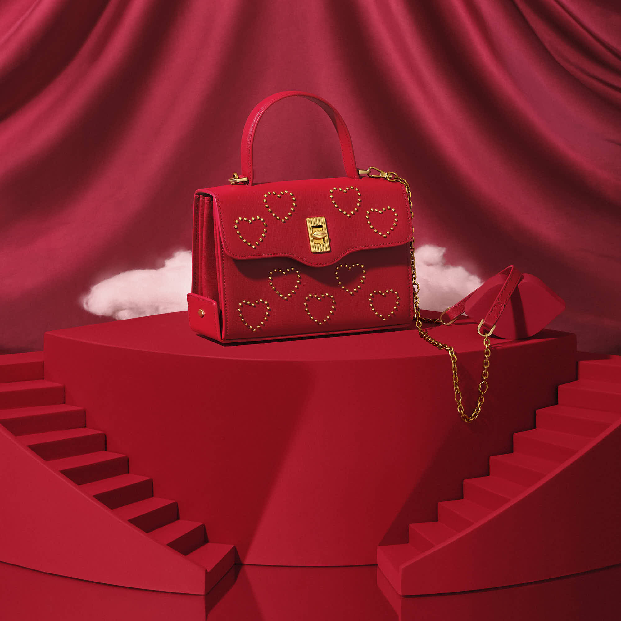 A stylish red handbag displayed on a red background with curtains, emphasizing luxury and elegance.