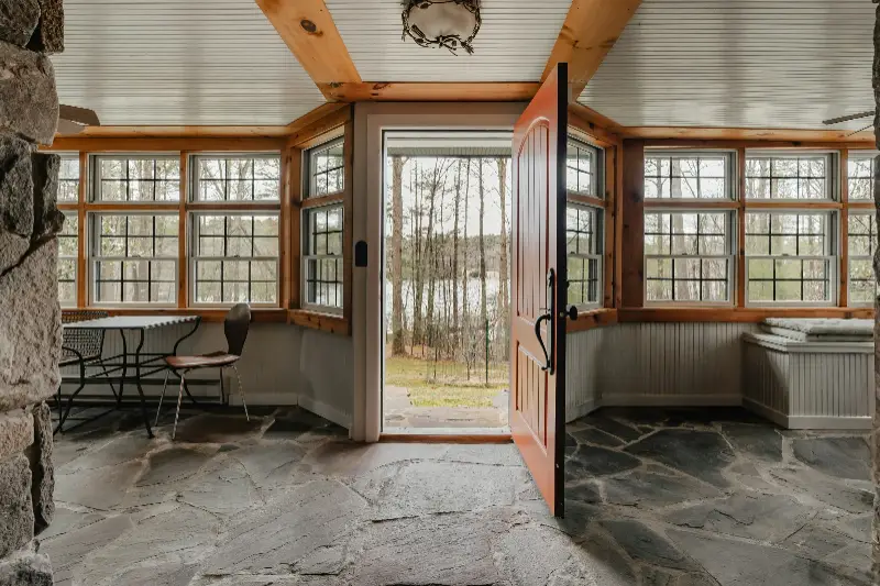 a room with a stone floor and stone walls