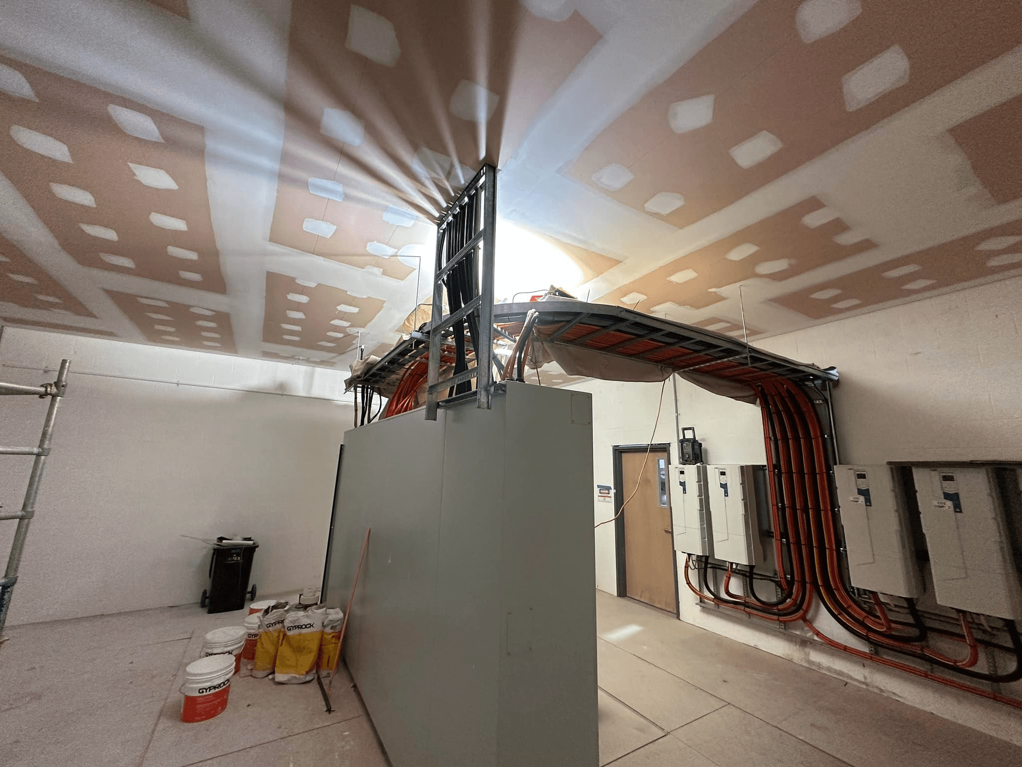 A large room with a lot of paint on the walls