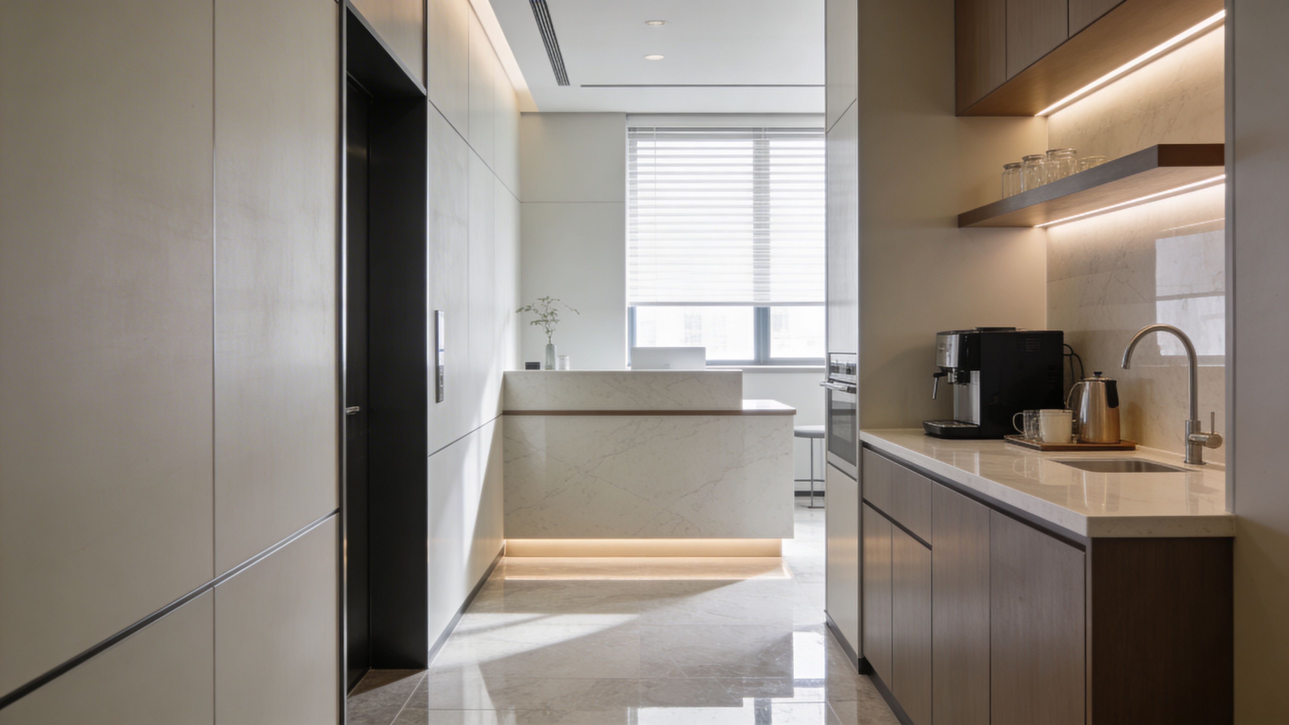 Compact office pantry with coffee machine, sink, and sleek cabinetry in a clean modern layout