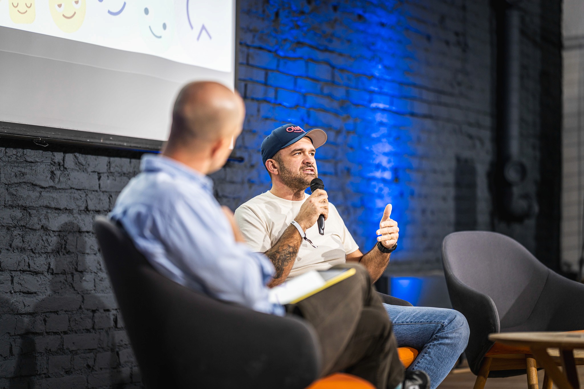 Interview-style conversation with a guest speaker during a conference session.