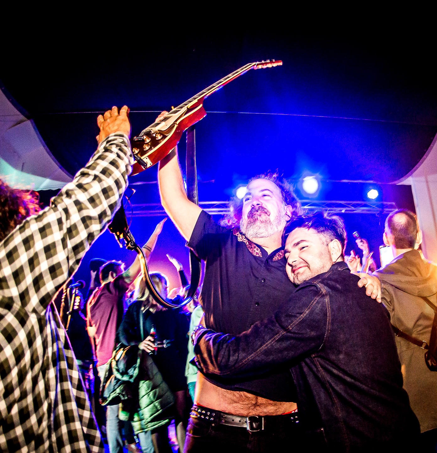Man in VR headset interacts with green holographic code displayed on a curved screen.