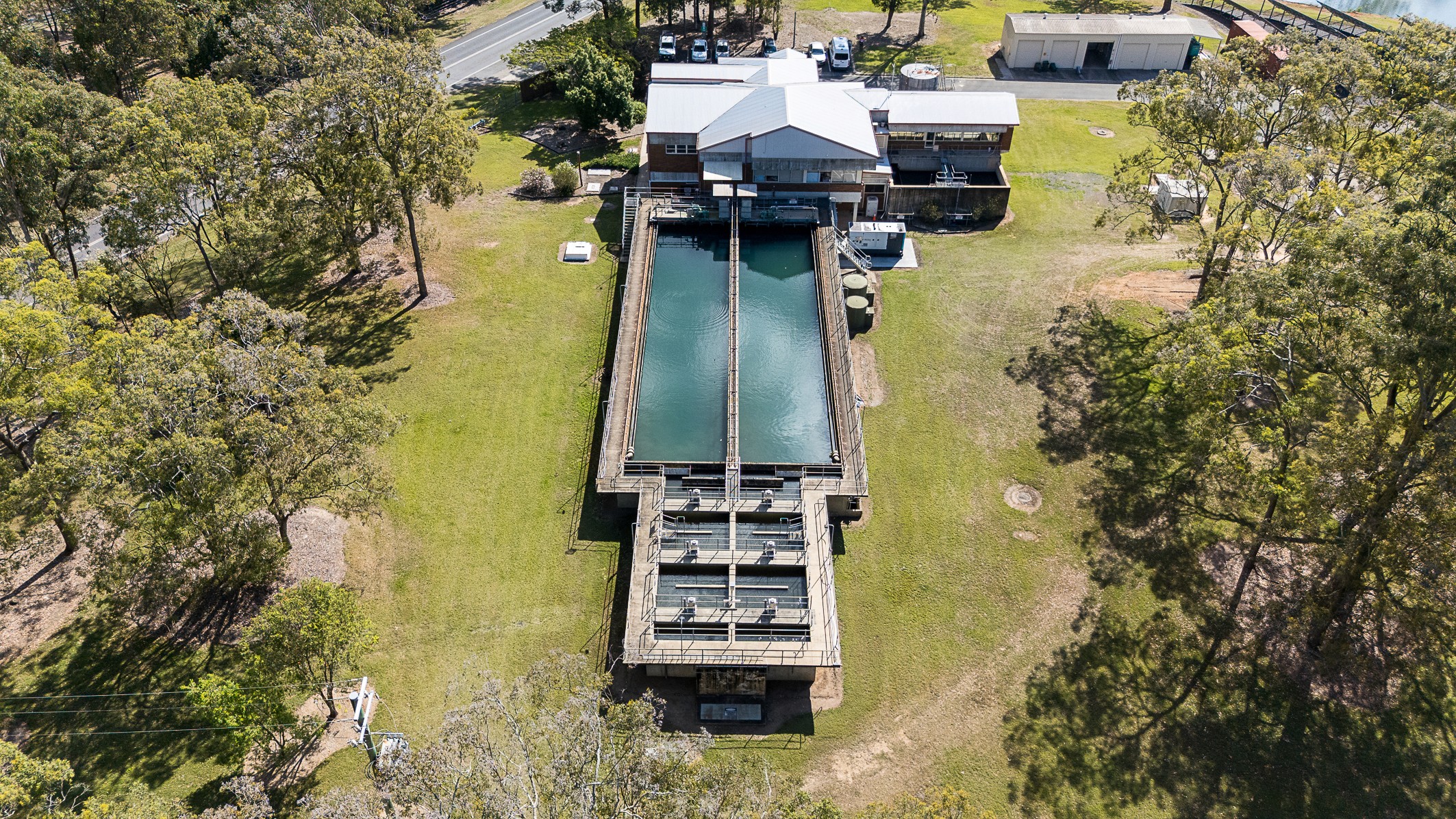 Construction works at a sewage treatment plant site, including excavation and waterway management overseen by Uminex