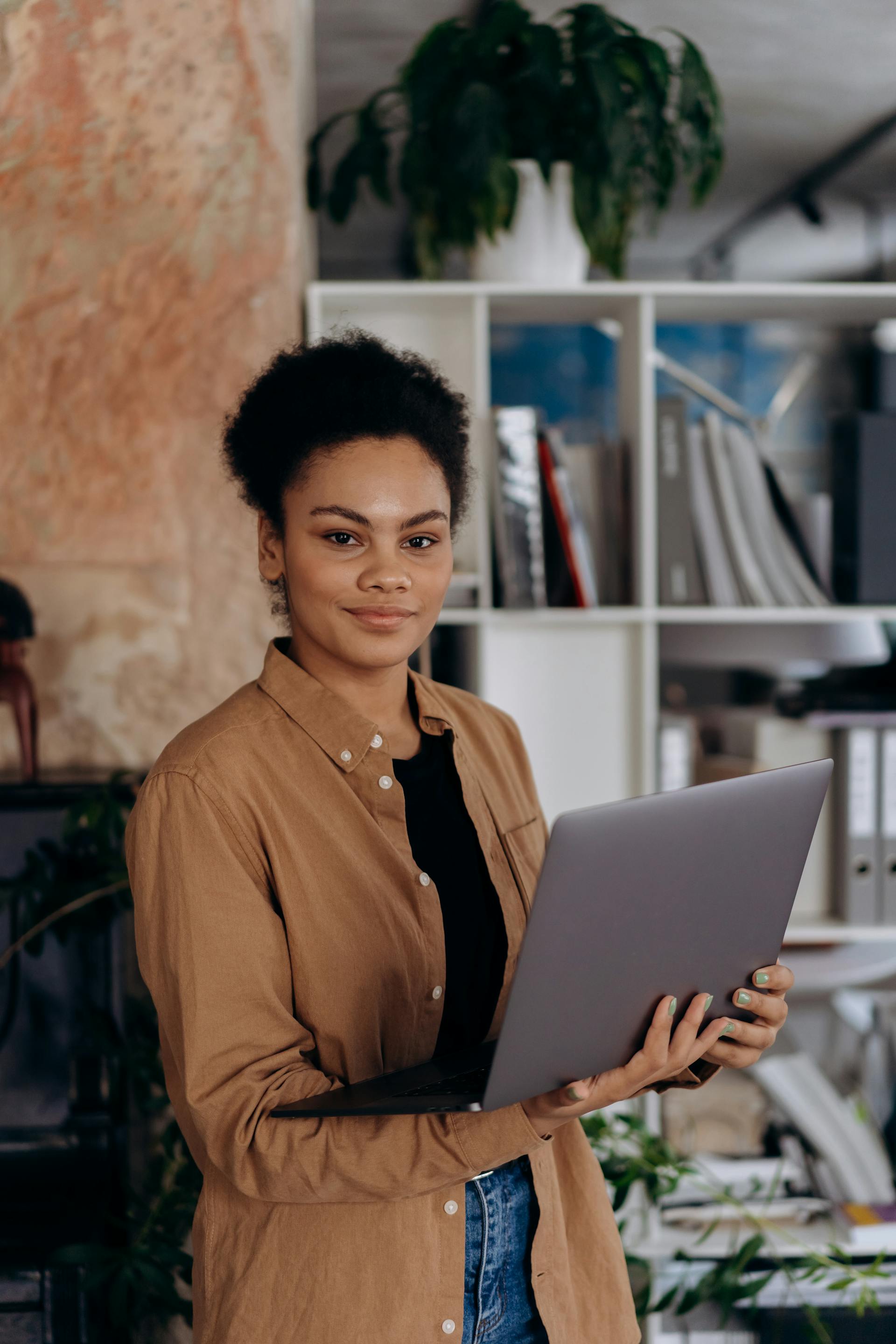 A Woman Holding a Laptop