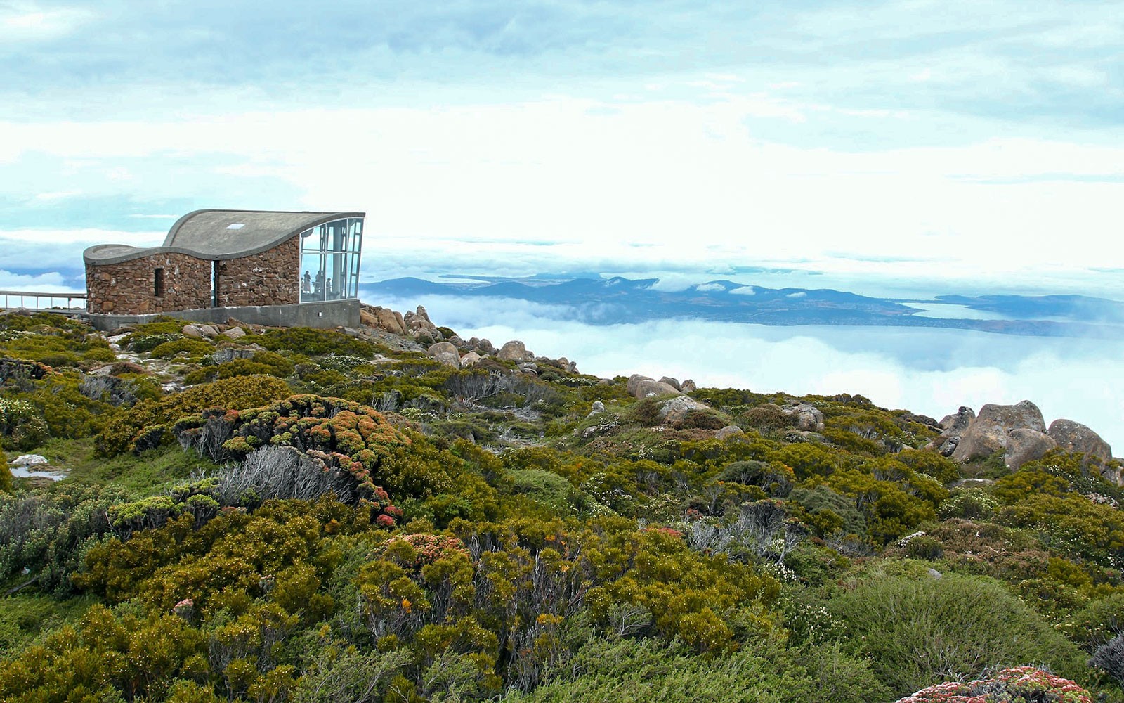 kunanyi Mt Wellington summit view with observation shelter and distant landscape.