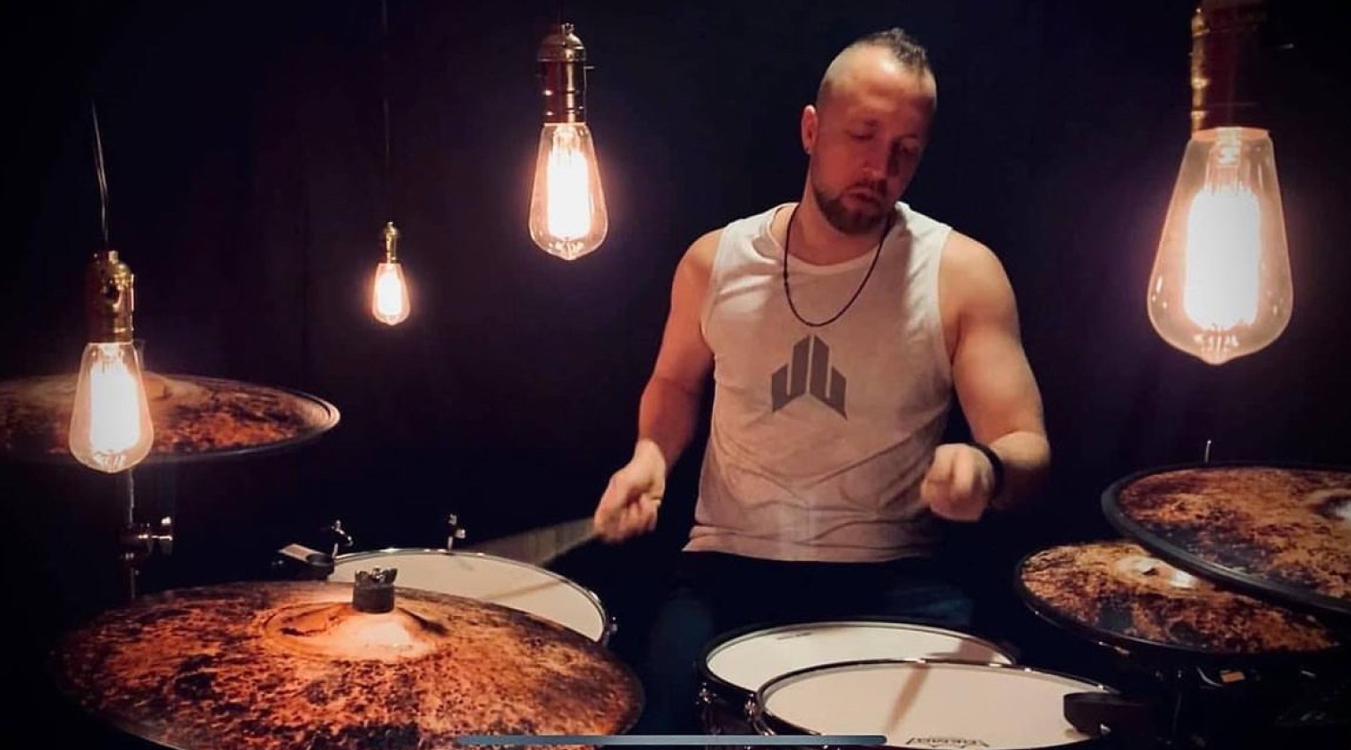Photo of Ben playing drums