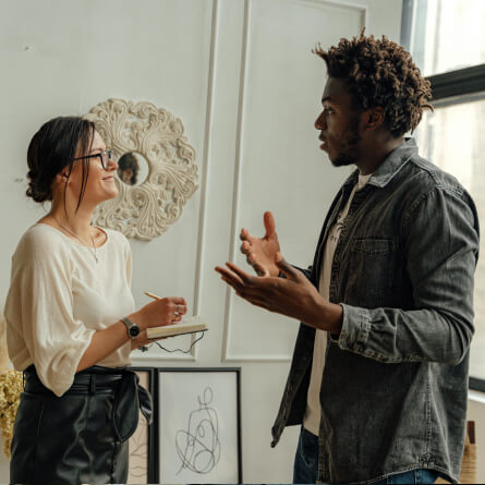 A man talking to a woman