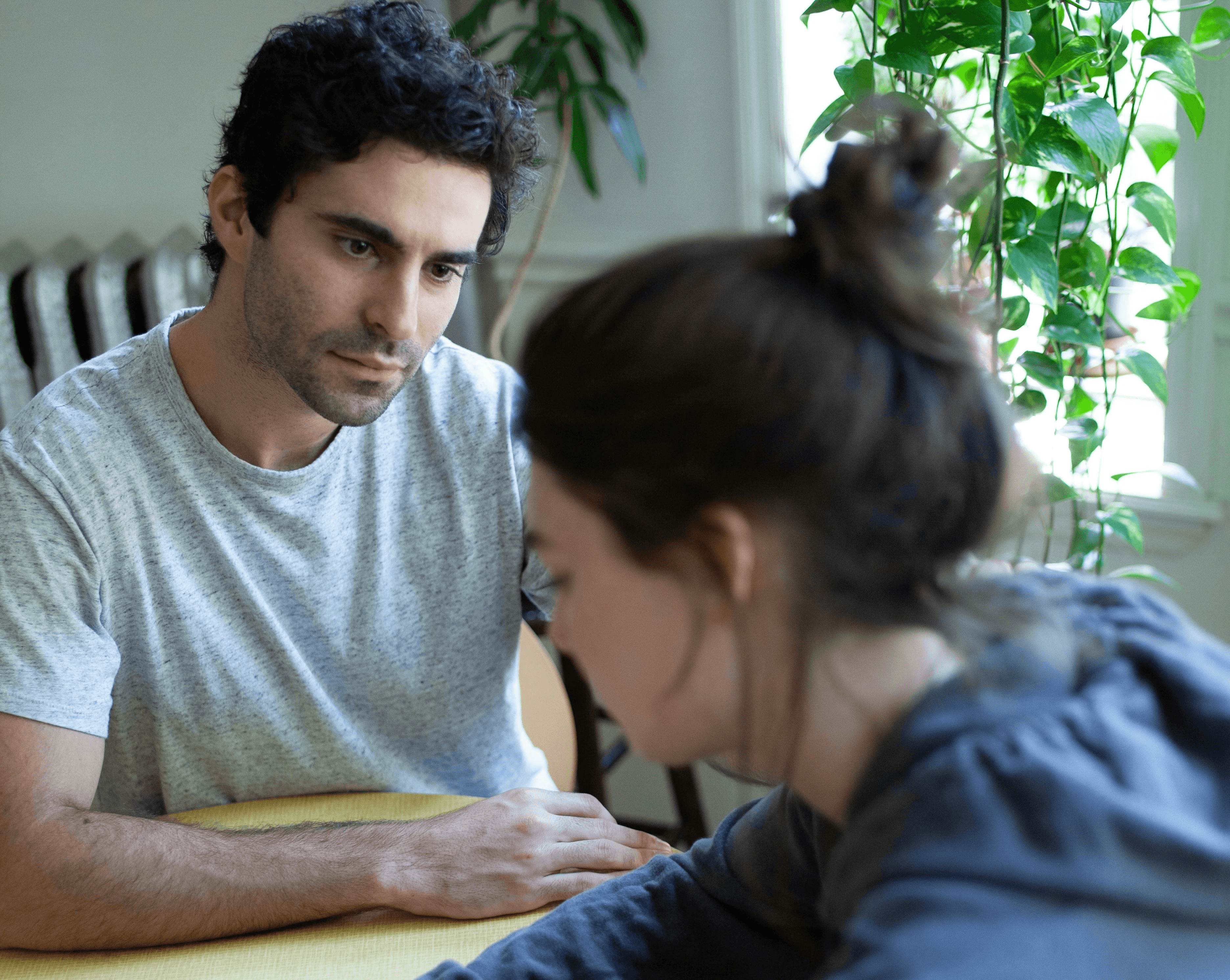 man and woman sitting at table