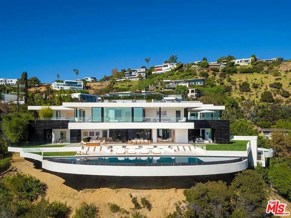 Contemporary home and terrace surrounded by mature trees, architectural reference photograph