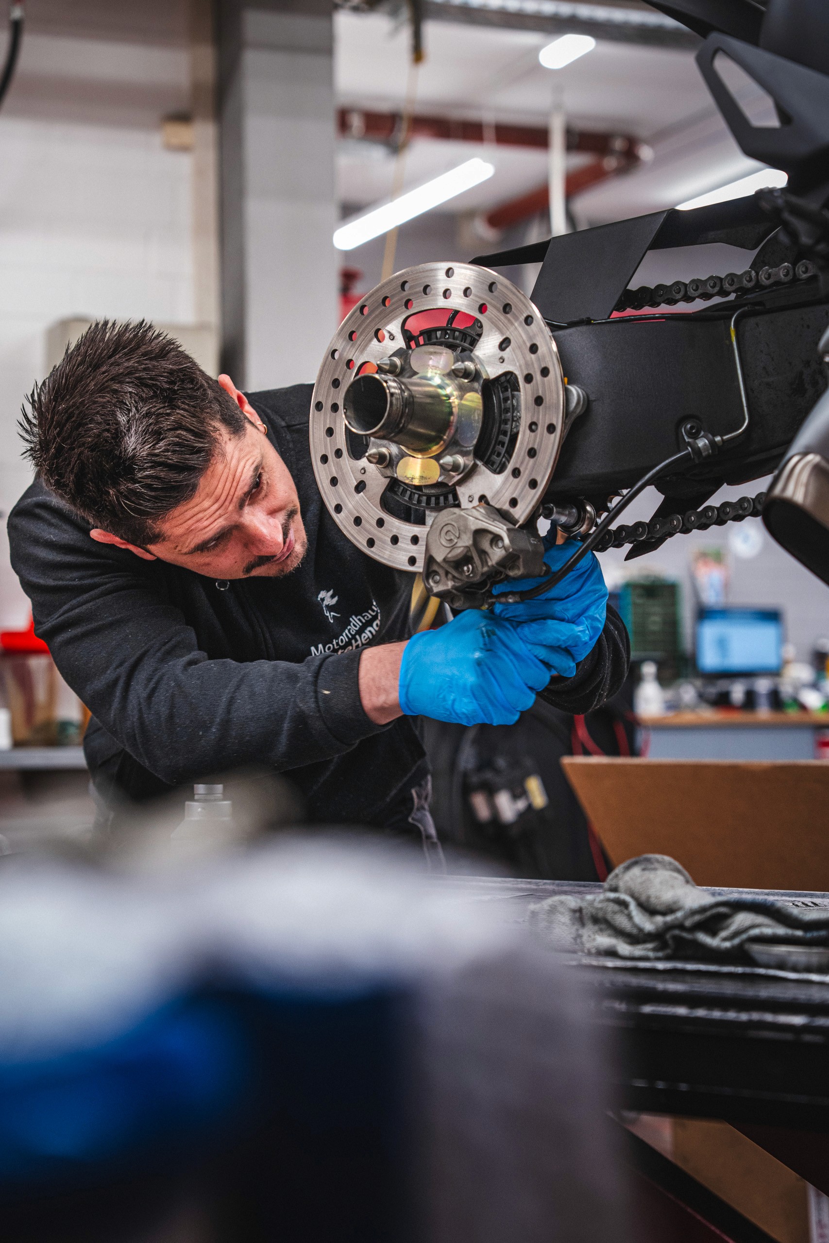 Professional headshot of a person in a formal setting.