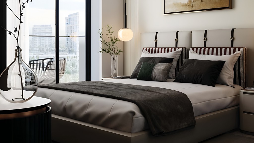 A spacious bedroom in Al Haseen Residence featuring a large bed and a window allowing natural light.