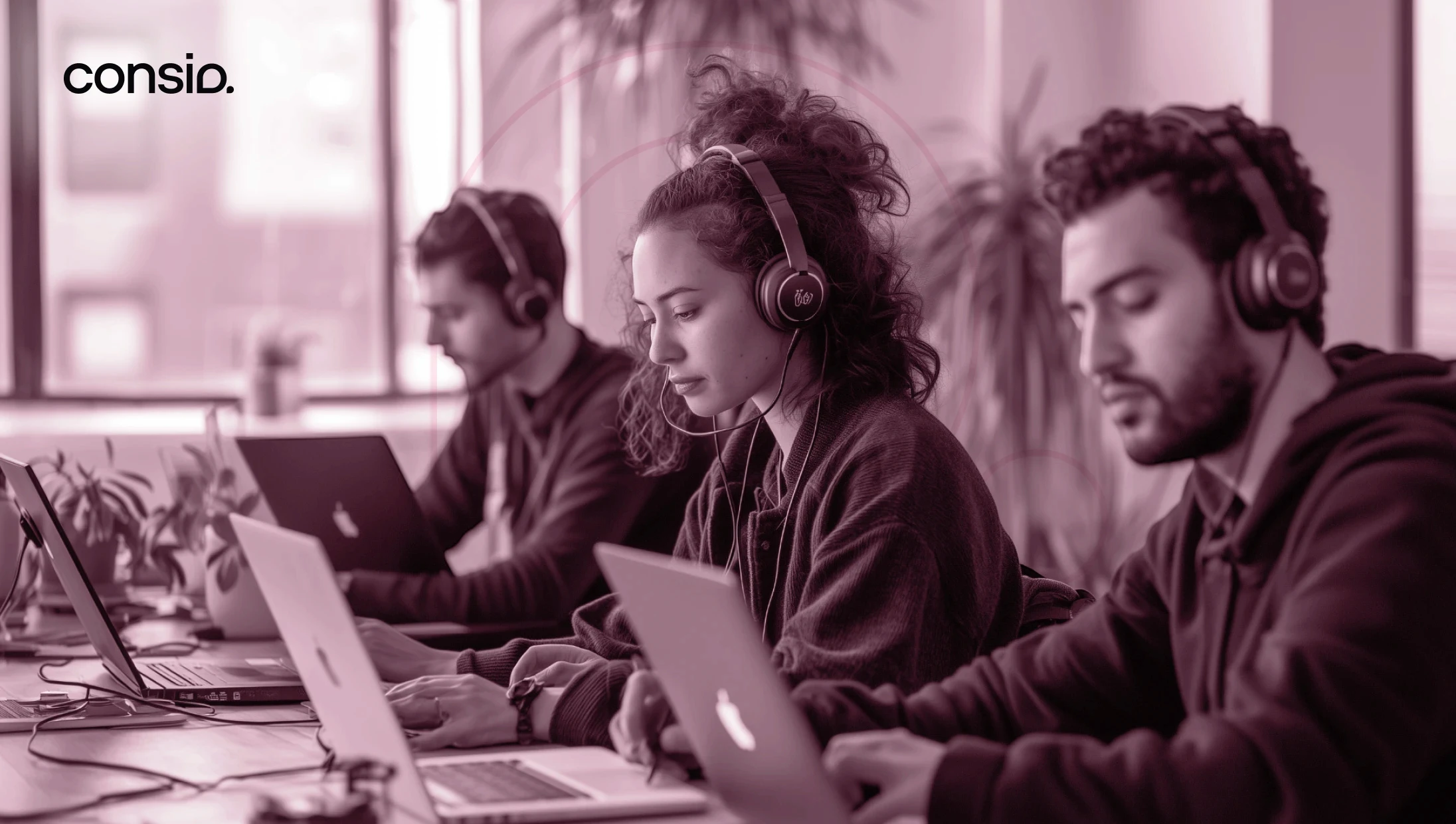 Photo of 3 sales agents making calls and working on their laptop