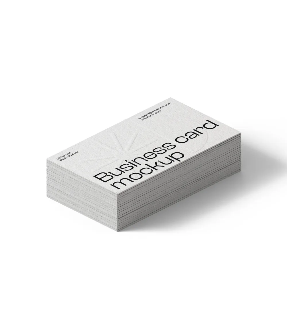 Stack of textured business cards mockup on a white background. The cards feature minimalist black text and subtle embossed details, ideal for showcasing professional branding designs.