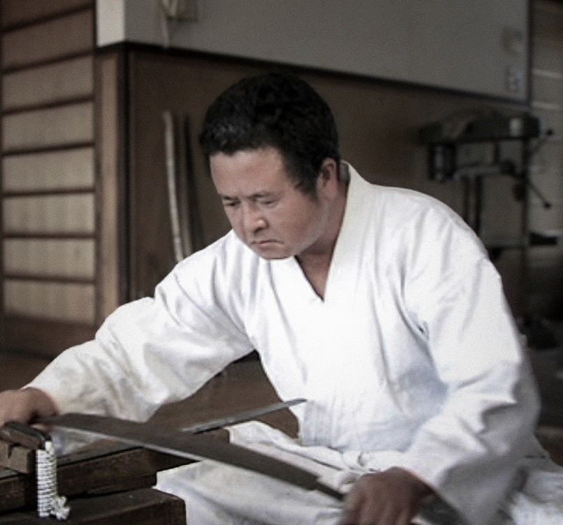 Swordsmiths hammering iron in a team