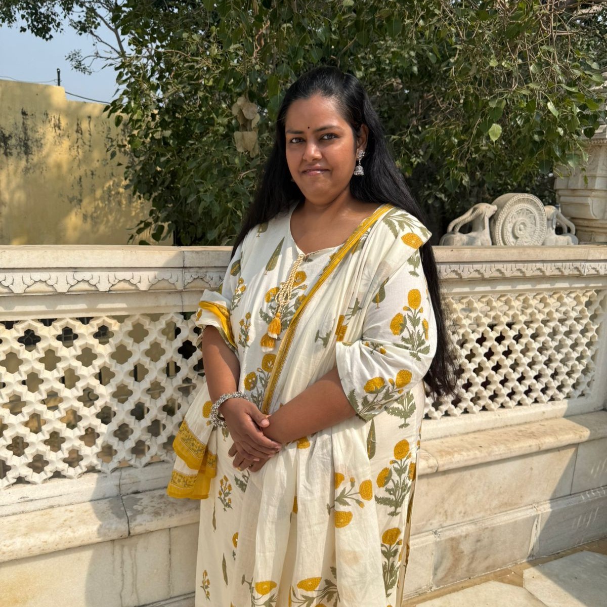 A person wearing the white shirt looking at the left