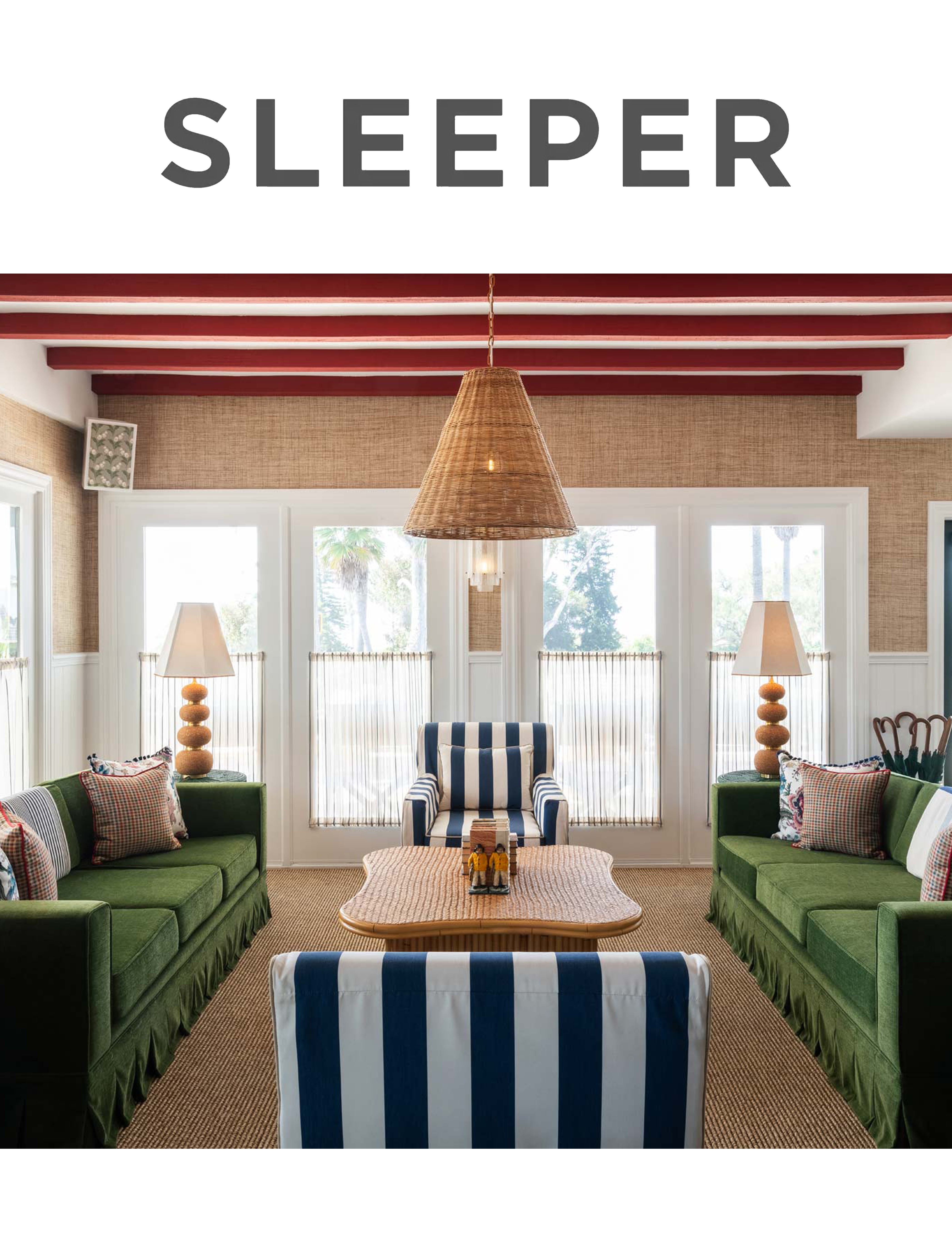 Boutique hotel bed and nightstand with folded sheets and striped headboard