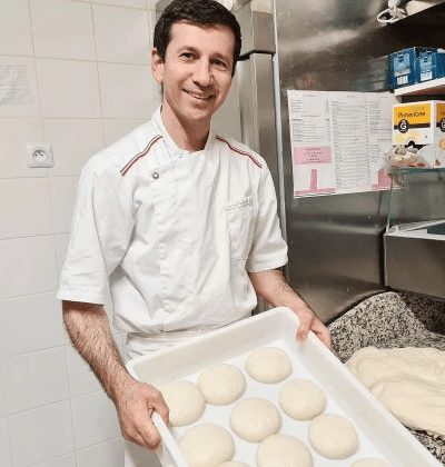 Abstract blurred motion of people working in a colorful office.
