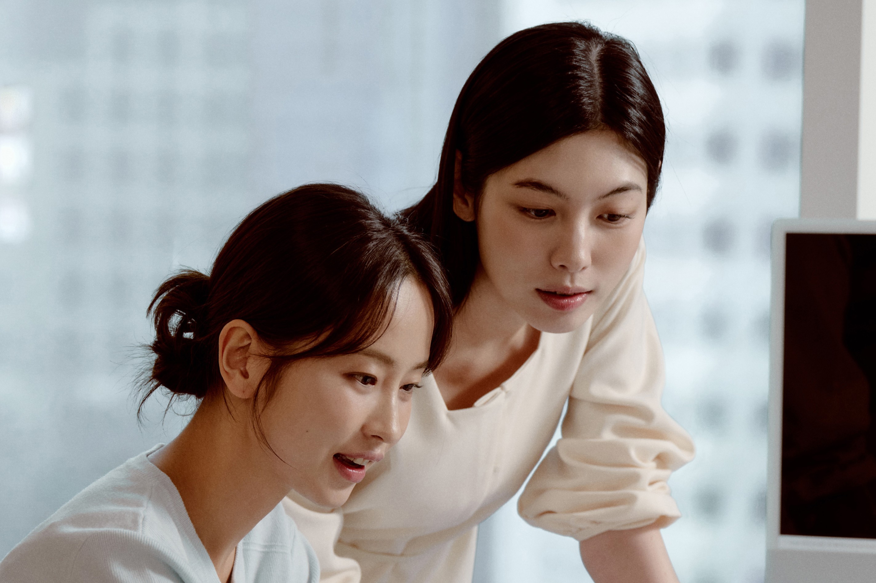 Two students smiling during a language learning session at 612 Academy, reflecting an engaging and human-centered learning experience.