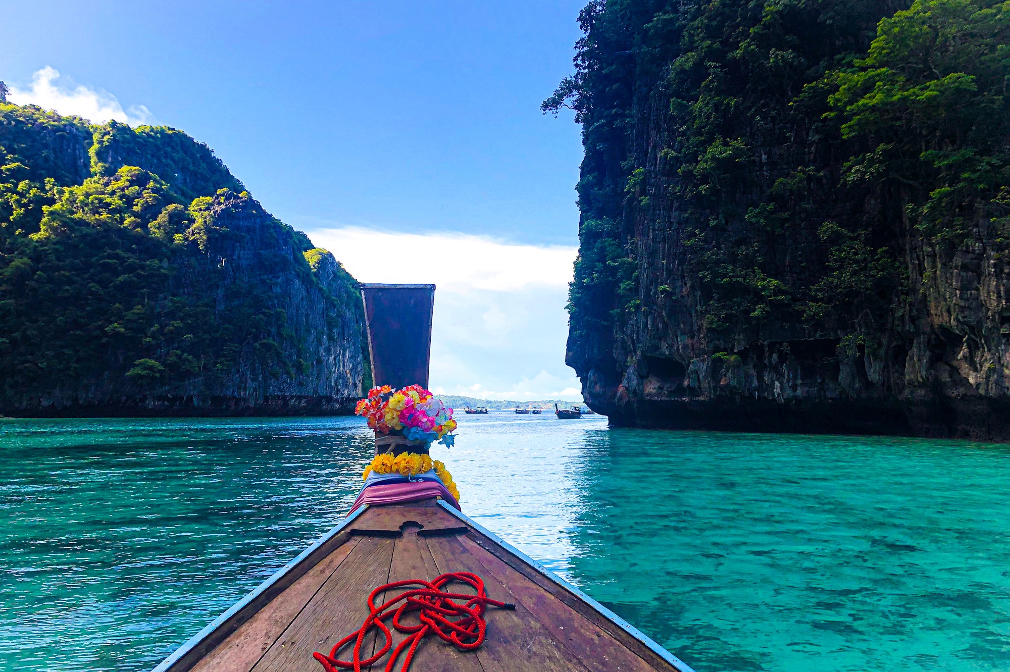 Tropical beach with umbrellas and lounge chairs.