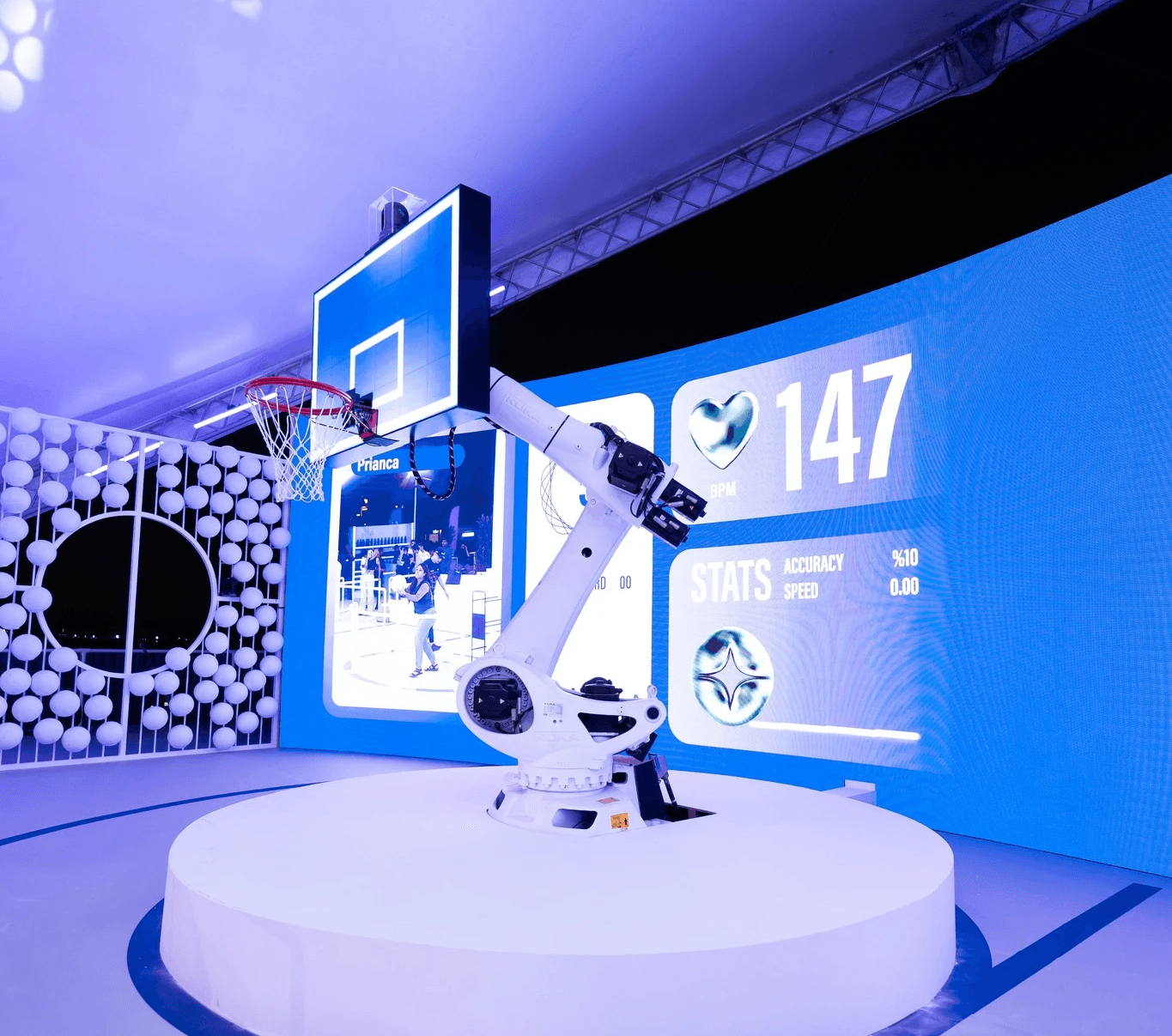 Hand holding a sleek black smartphone or mobile device against a light background