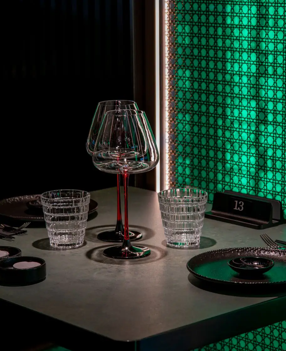 Table set in front of a glowing glass column