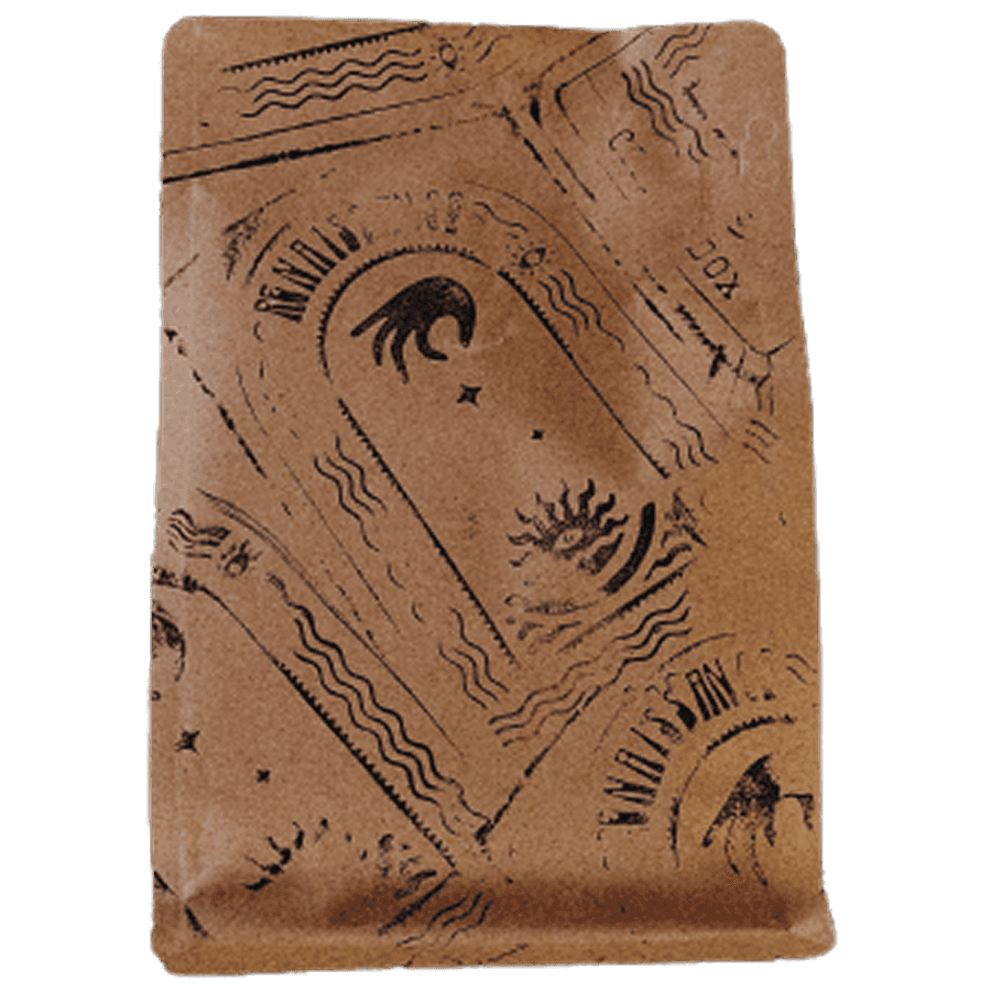 A chocolate bar with a textured surface featuring etchings and patterns, set against a plain background.