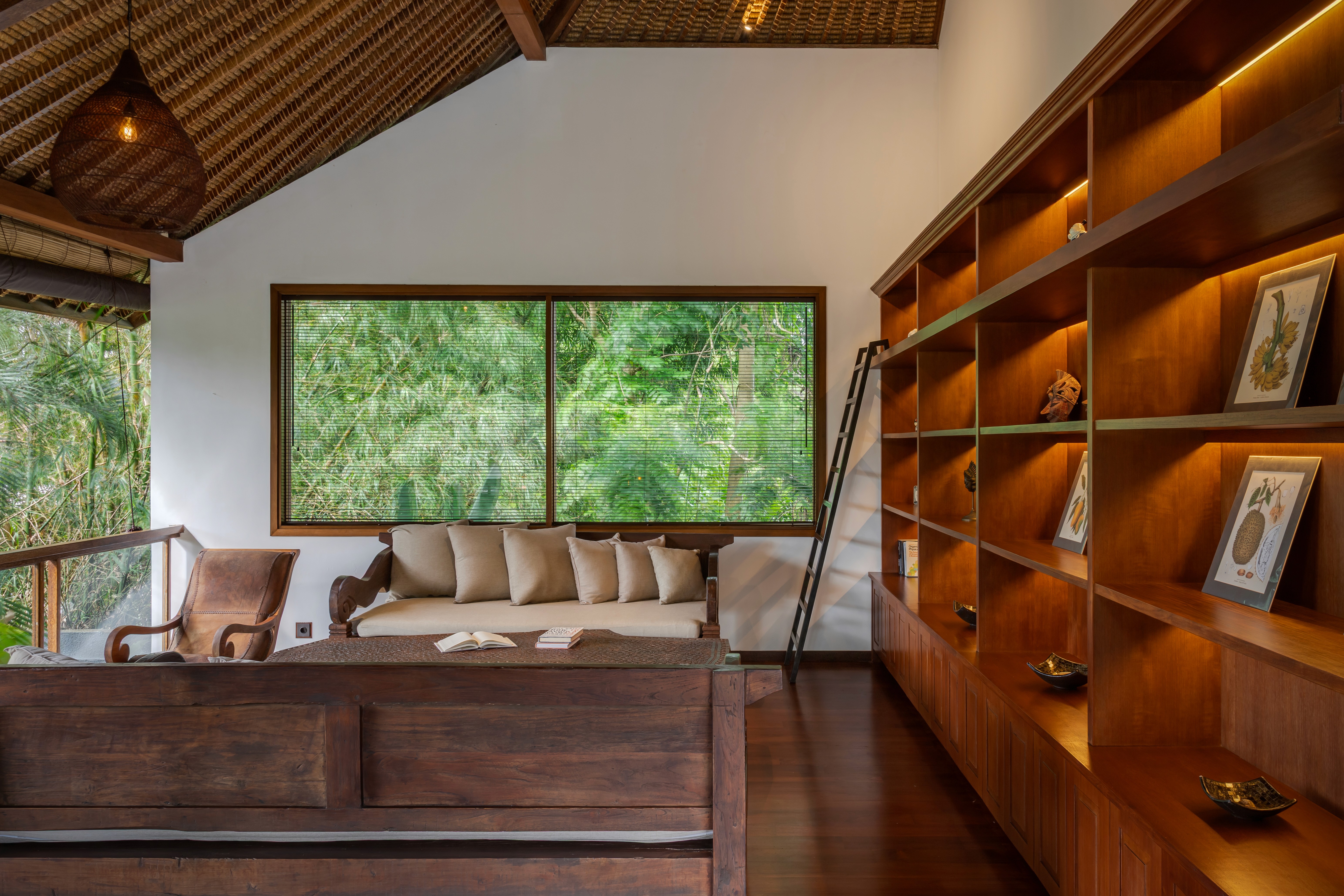 Modern hillside house with stilts and glass railing