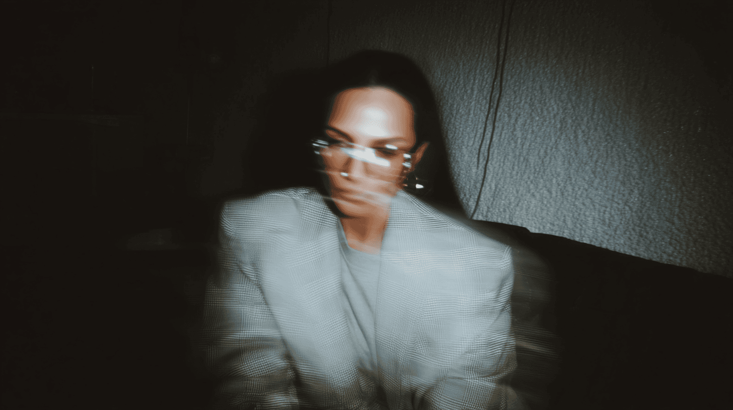 Portrait where Charle is in profile and looks directly at the camera with a slight turn of the neck.