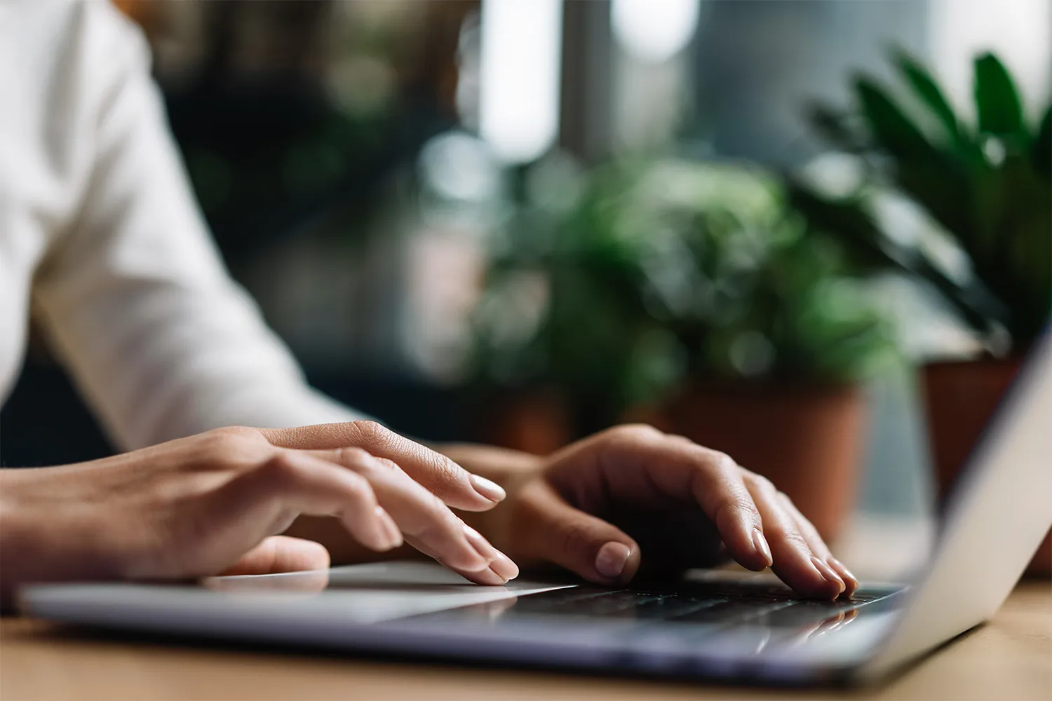 woman searching for health insurance from laptop after car injury - car accident