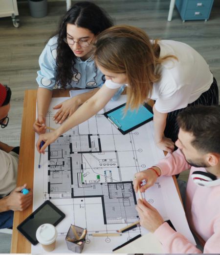 Group of people working on archetecture and diagrams