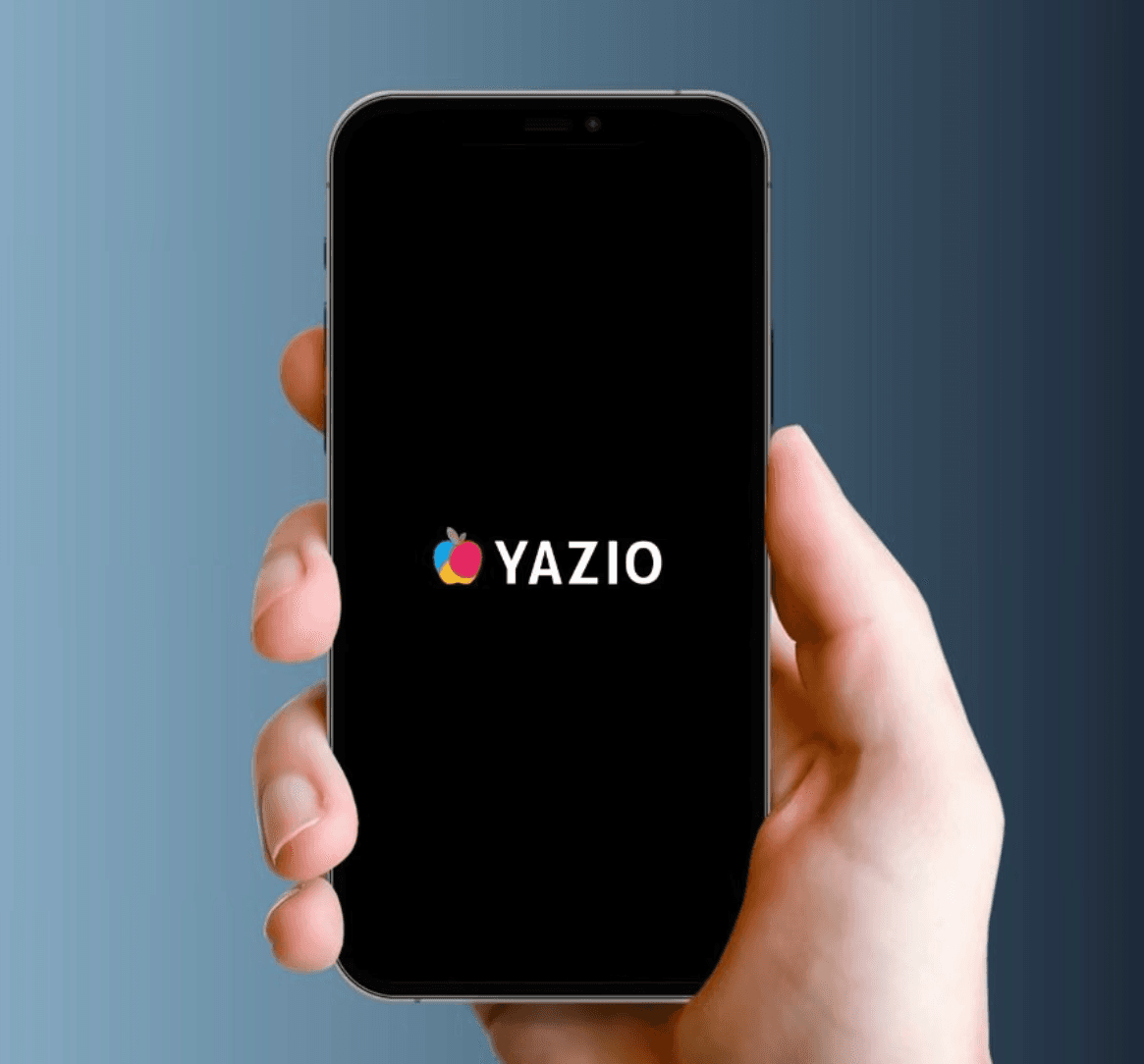 a person holding phone showing yazio app