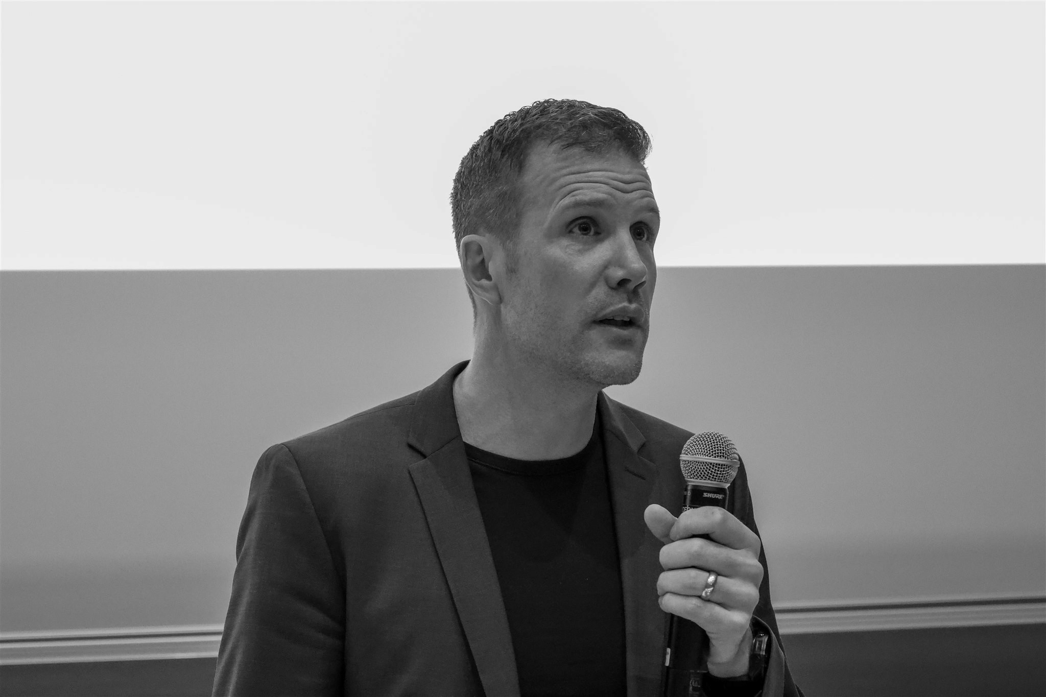 Black and white speaker portrait during EthereumZüri conference in Zurich microphone during EthereumZüri conference in Zurich black and white