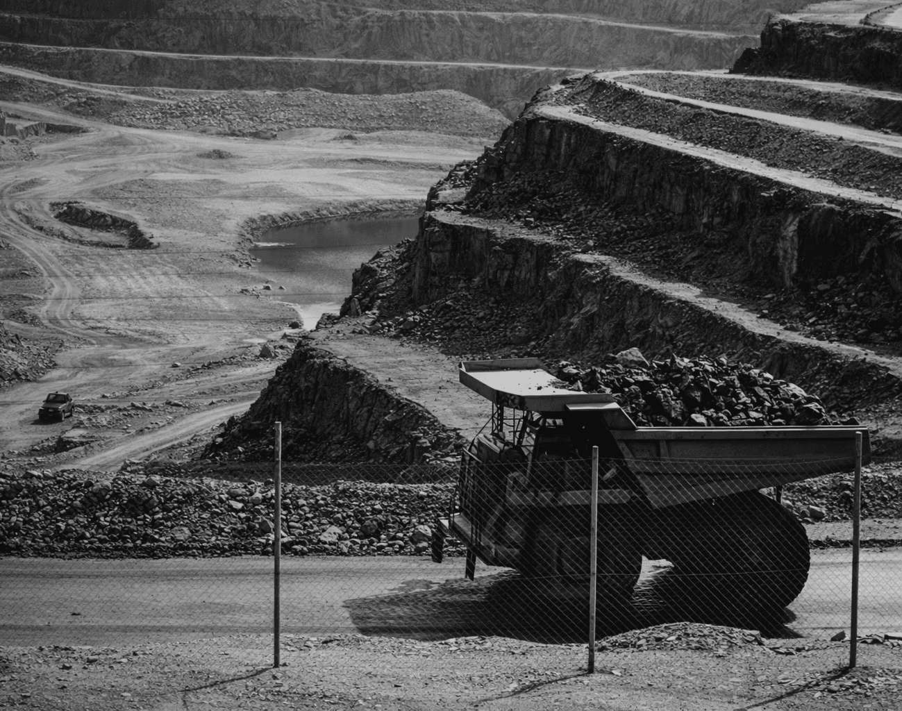 yellow and black truck on road near mountain during daytime