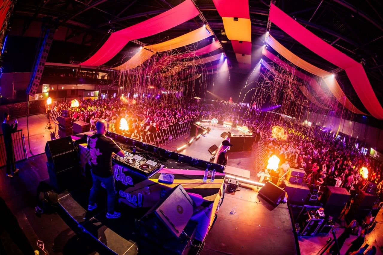 event with dancing crowd and dj