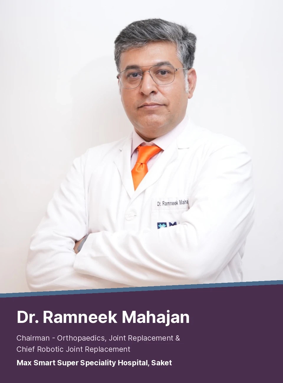 Dr Ramneek Mahajan, Chairman of Orthopaedics and Joint Replacement at Max Smart Super Speciality Hospital, Saket, standing with arms crossed in a white coat.