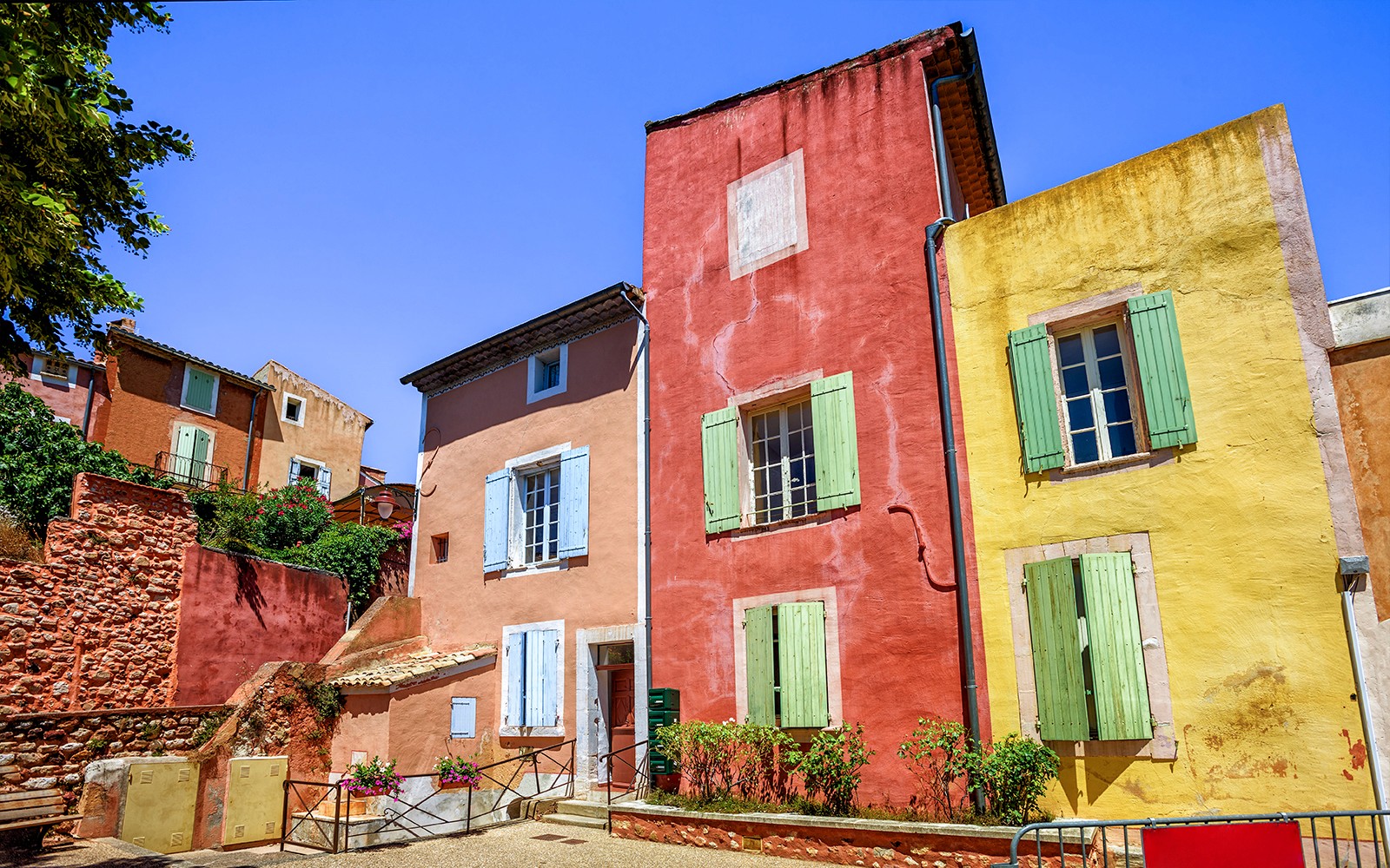 Colorful buildings in Roussillon, Provence, seen on a full-day guided tour from Avignon.
