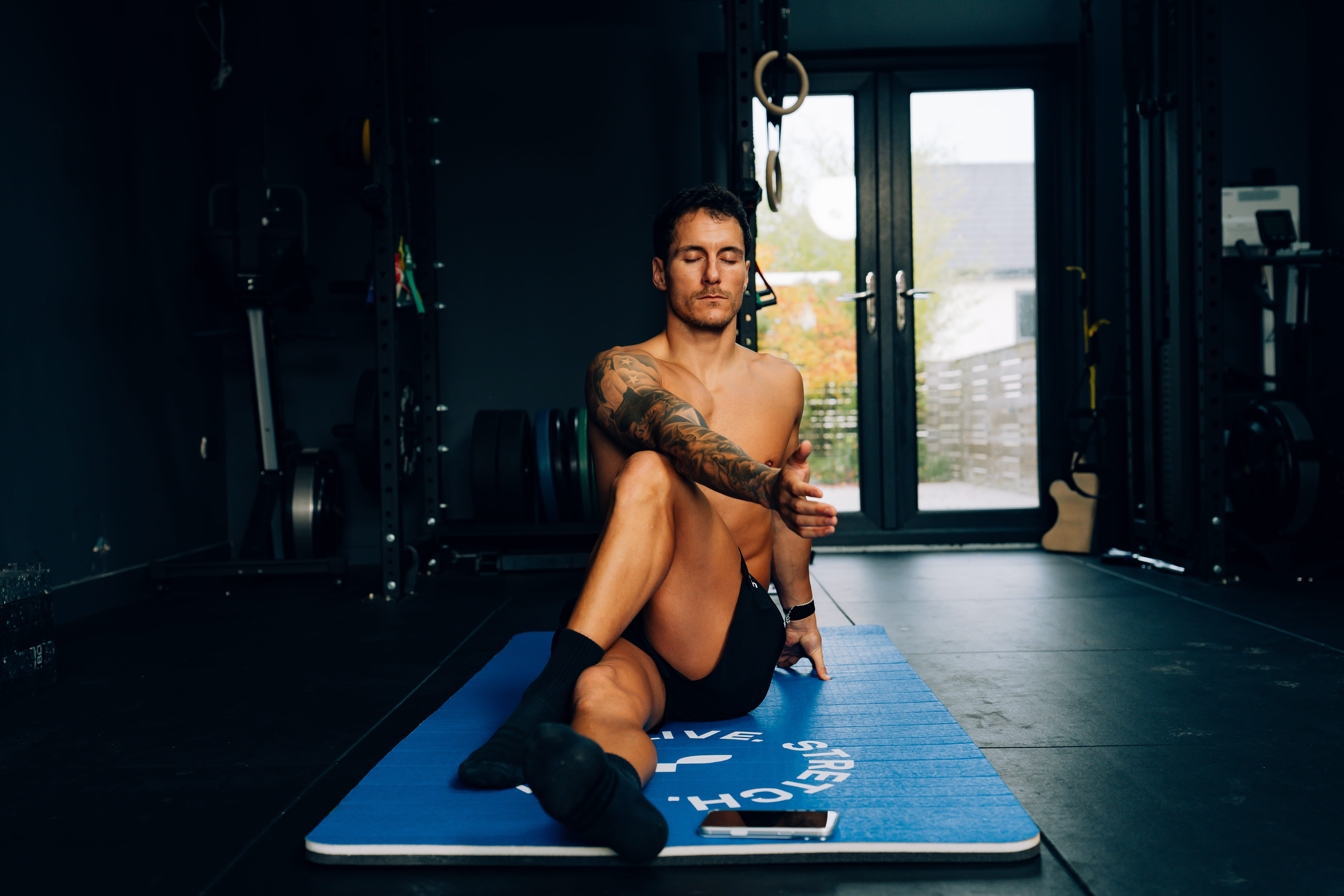 person on mat -  IV Therapy for Athletic Performance and Recovery