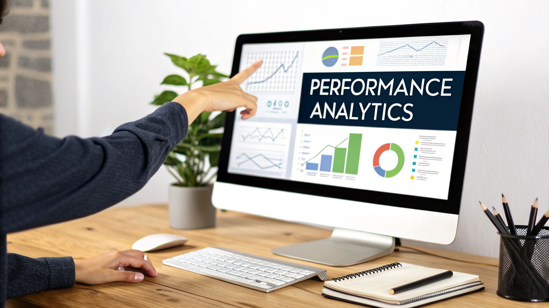 Person pointing at a computer screen displaying performance analytics and data charts.