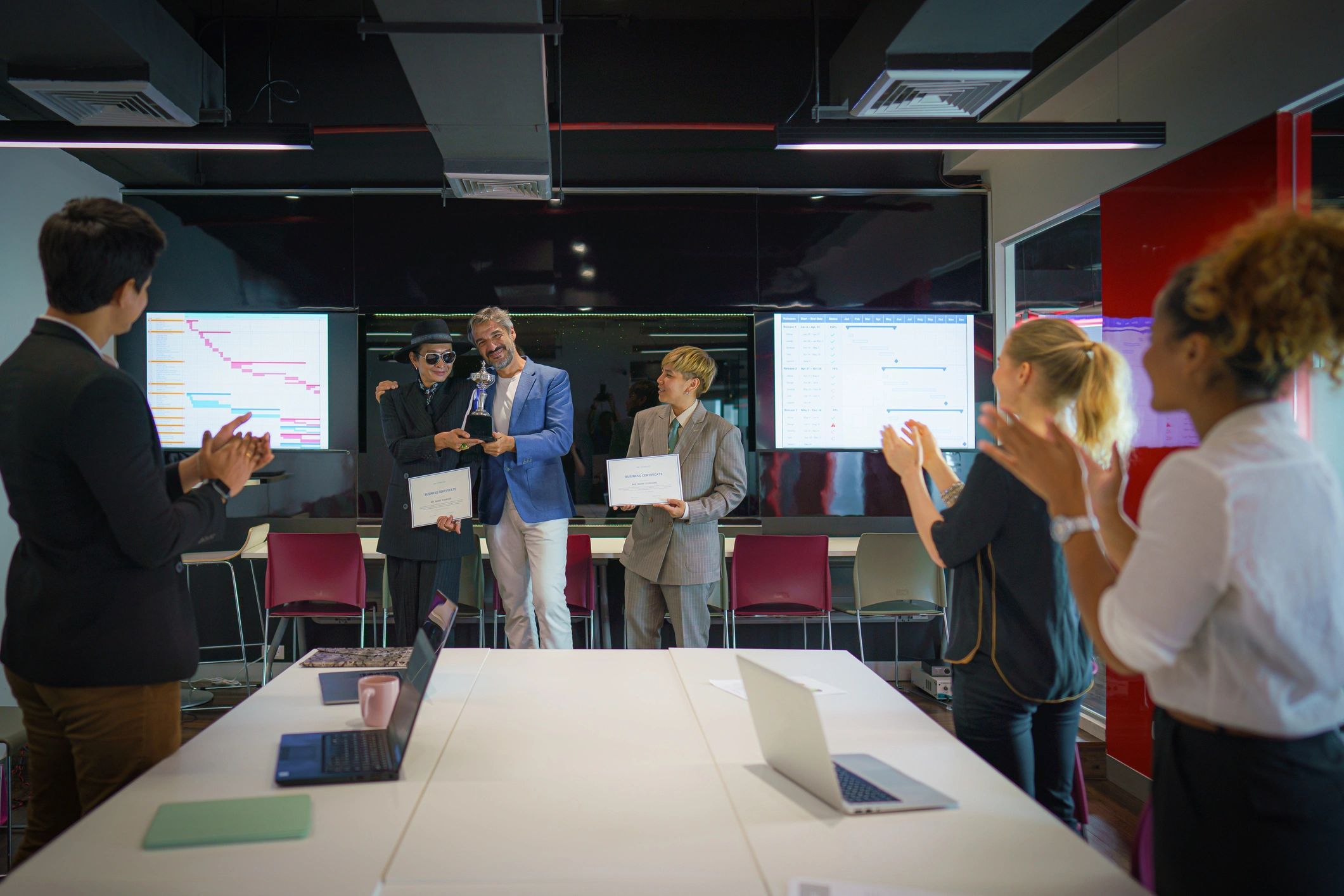 a black and white living room with a large tv