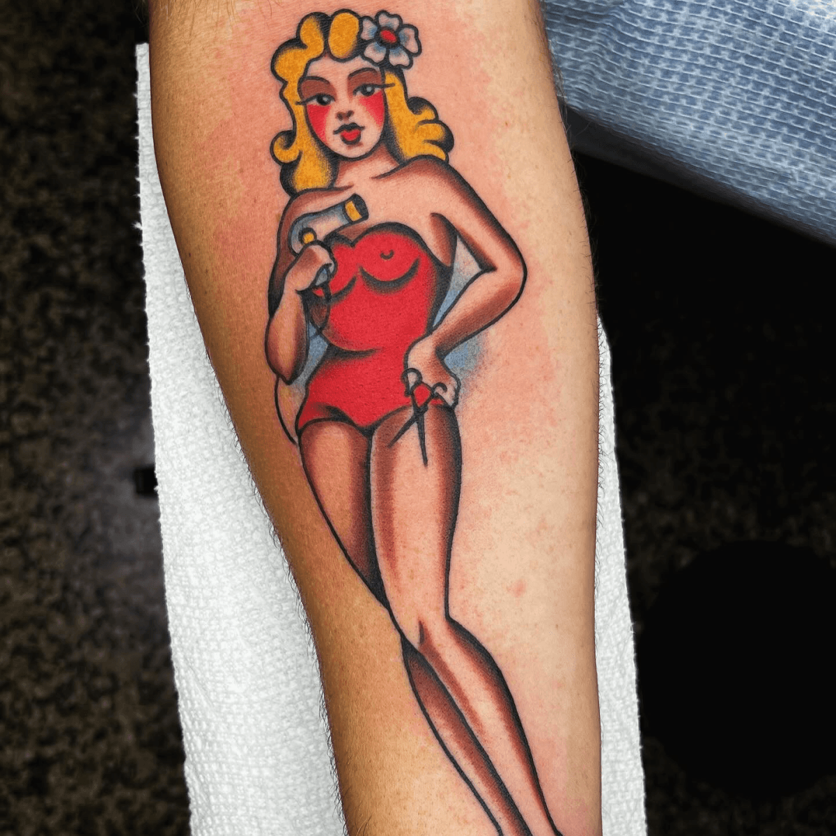 color tattoo of a hairdresser pin-up girl