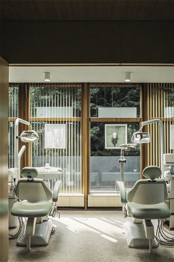 a person in a dentist chair with a mask on