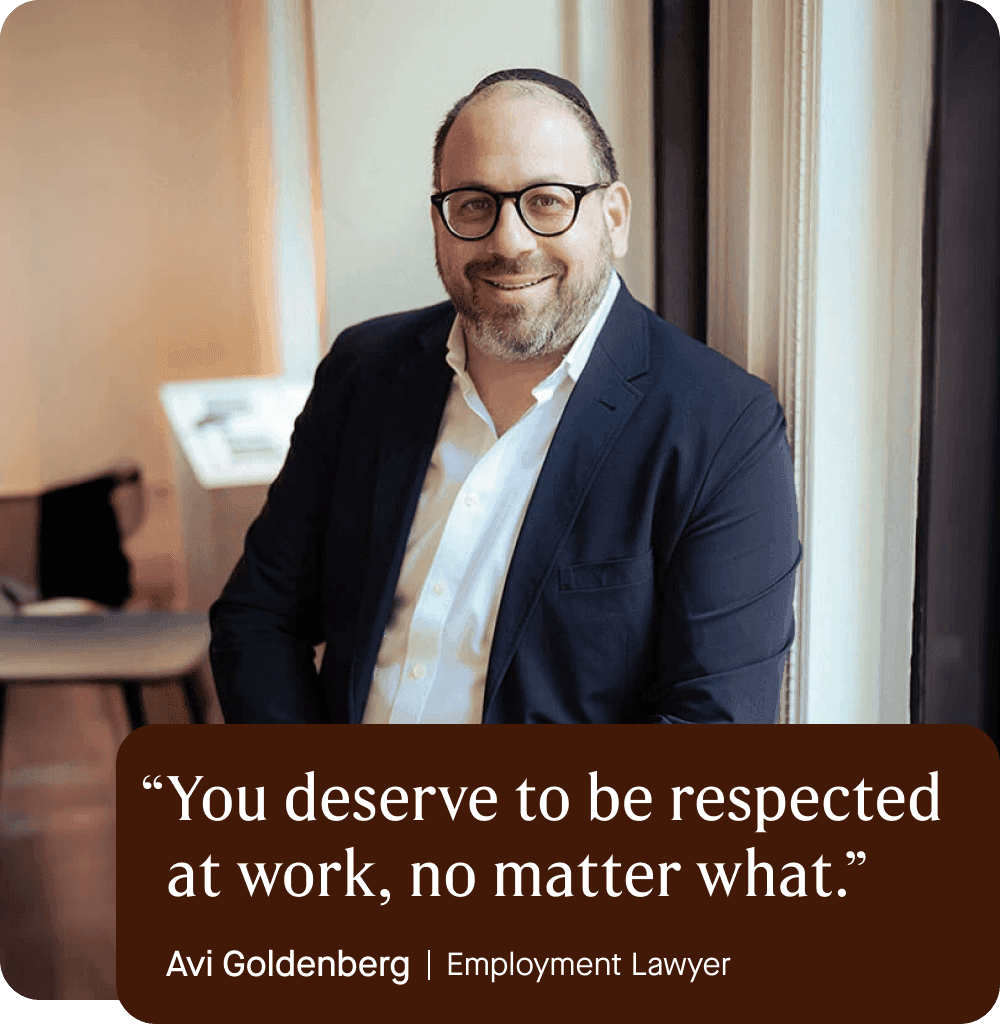 Image of Avi Goldenberg, Employment Lawyer, in his office wearing a button down shirt and suit jacket, wearing glasses and smiling. Quote overlaid.