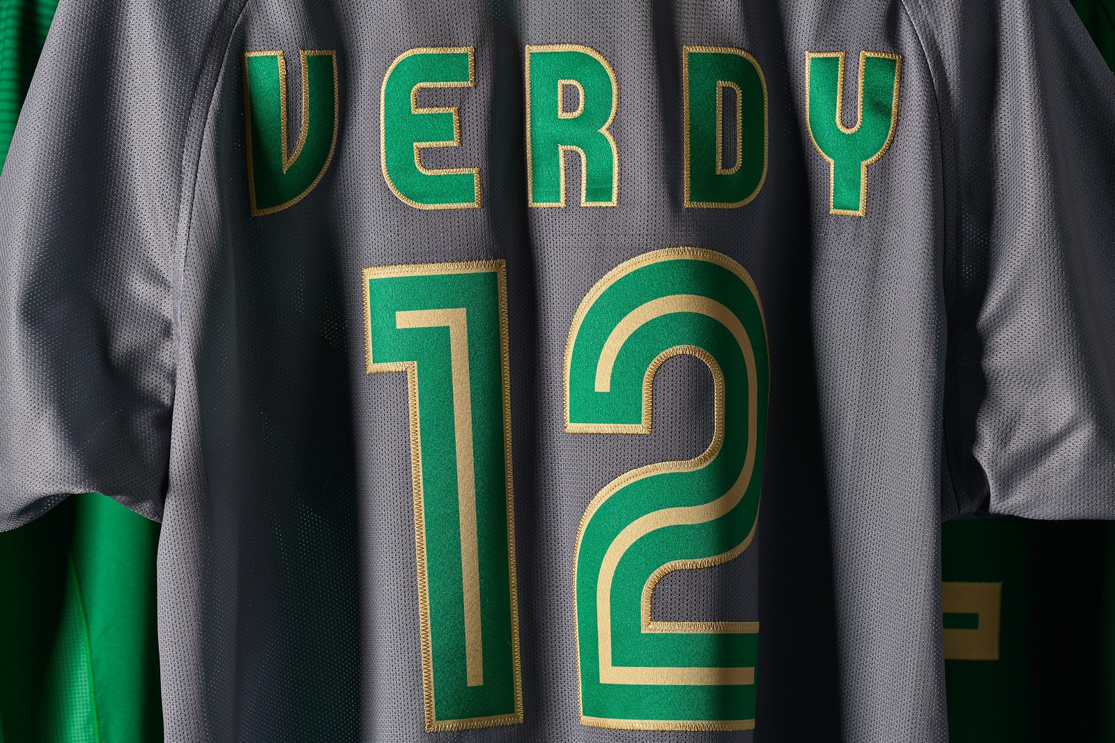 Gray sports jersey displayed, featuring the name "VERDY" and the number "12" in bright green.