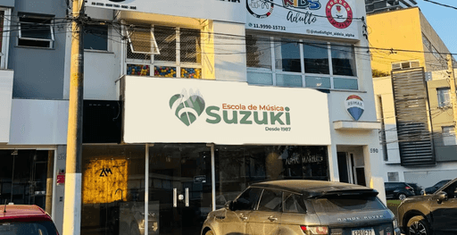 Woman in a beige turtleneck by an old computer and TV, retro 80s office portrait.