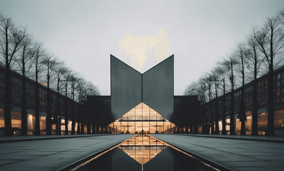Modern triangular building with a water fountains