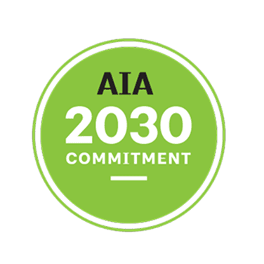 AIA 2030 Commitment logo in green circle with white text.