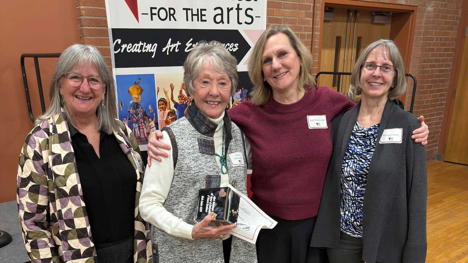4 women who volunteer at Beck Center stand together at a volunteer recognition event