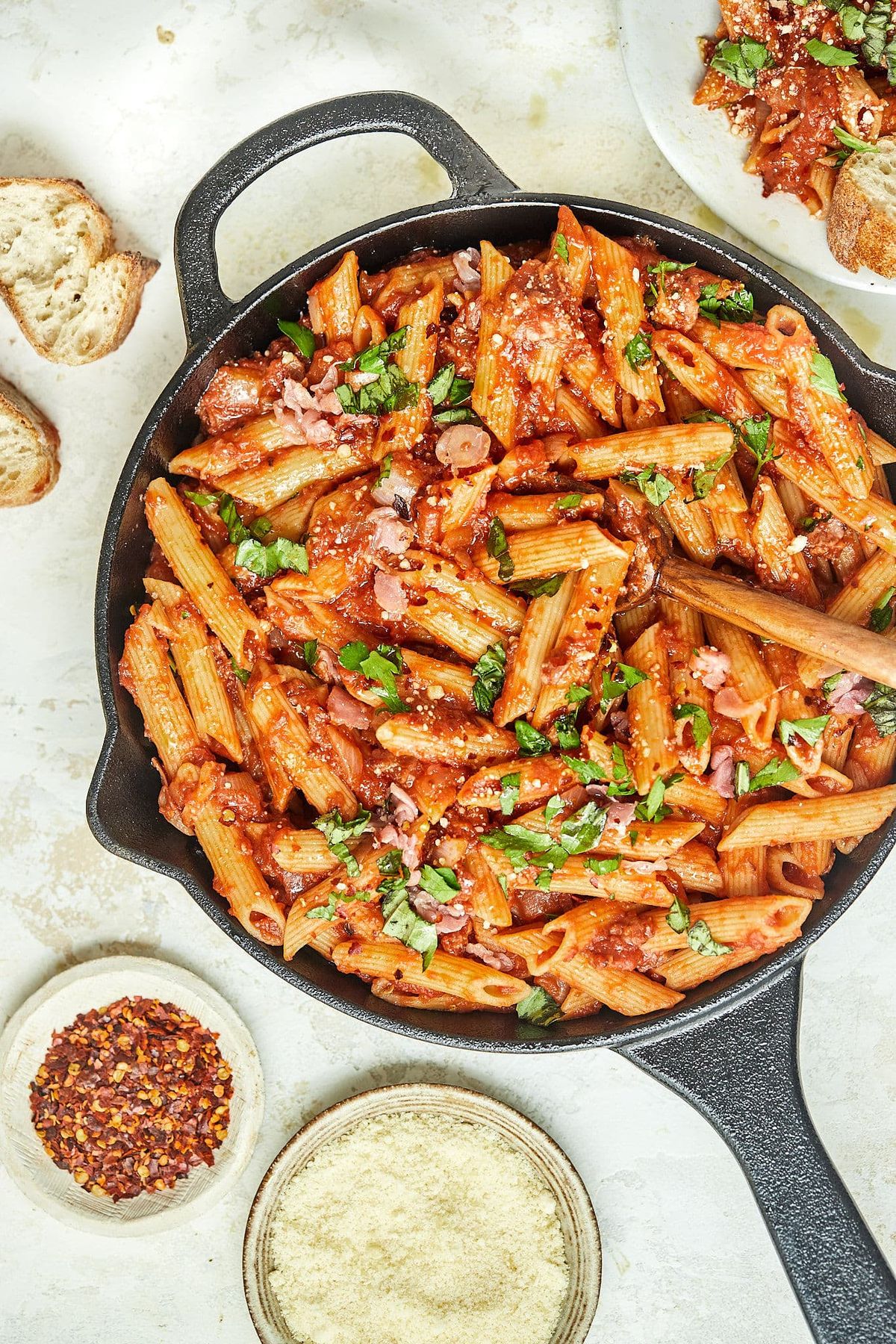 Penne Athena from Pasta 9 Toronto tossed in pesto pomodoro with roasted peppers, spinach, olives, sun-dried tomatoes, and feta.