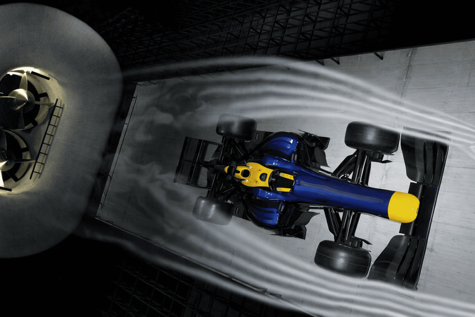 Motorcyclists race on a dusty dirt track.