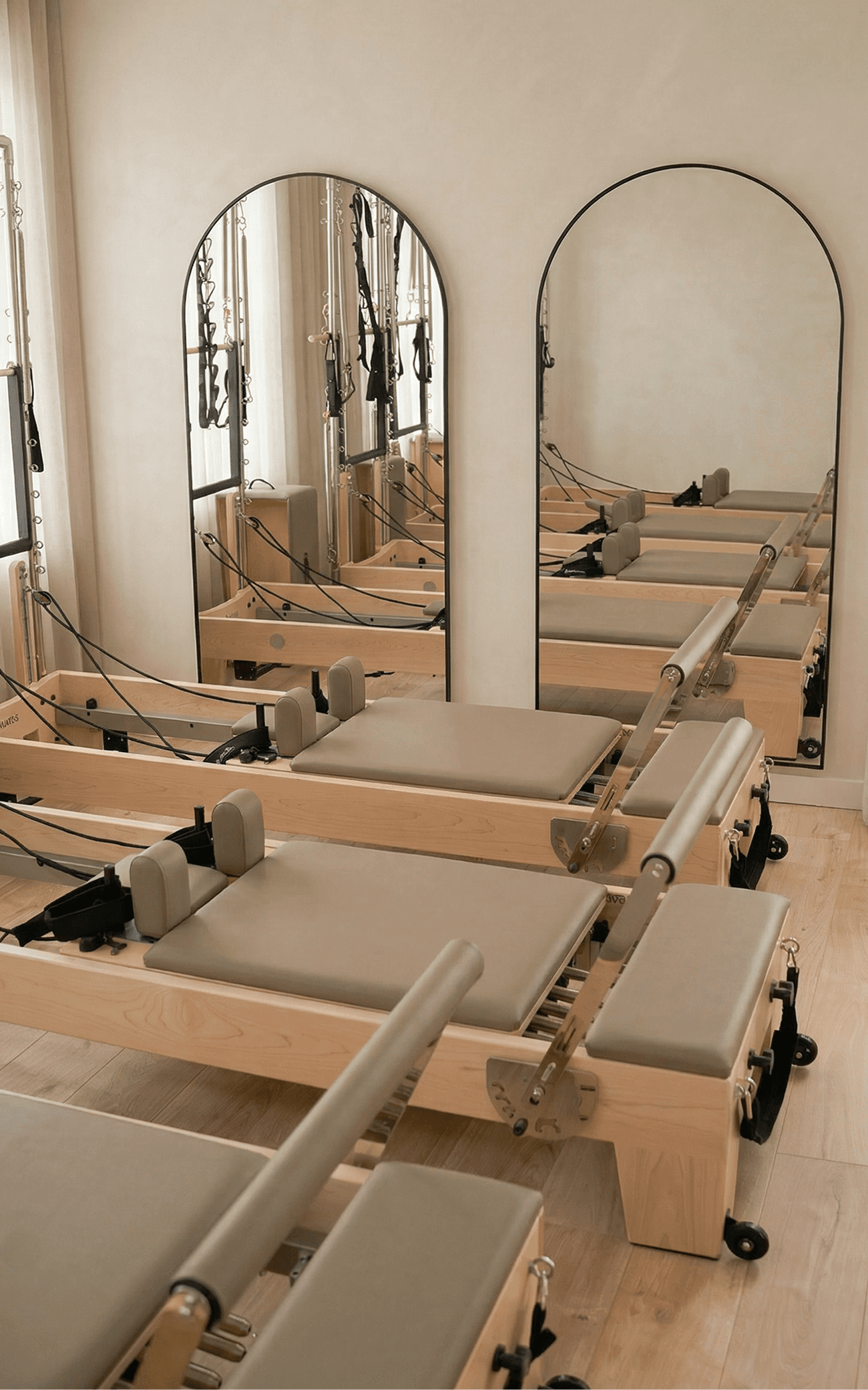 A cozy scene with warm sunlight casting stripes, featuring a potted plant and soft towels on a window sill.